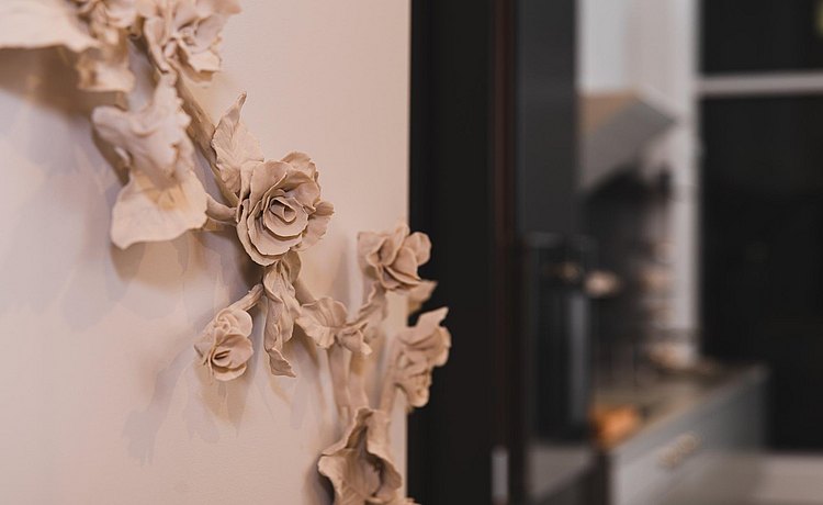 Porcelain flowers on wall