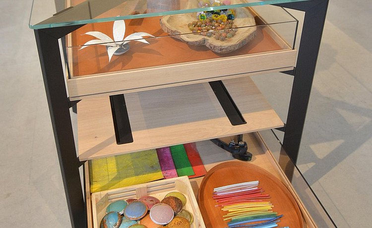 View of artwork and collection of tools and materials in the b Solitaire Glass